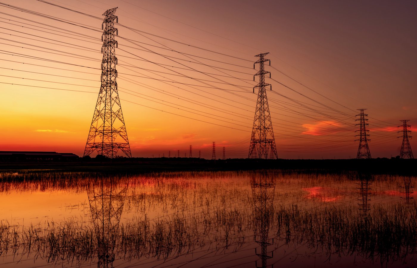High-voltage transmission corridor at dusk
